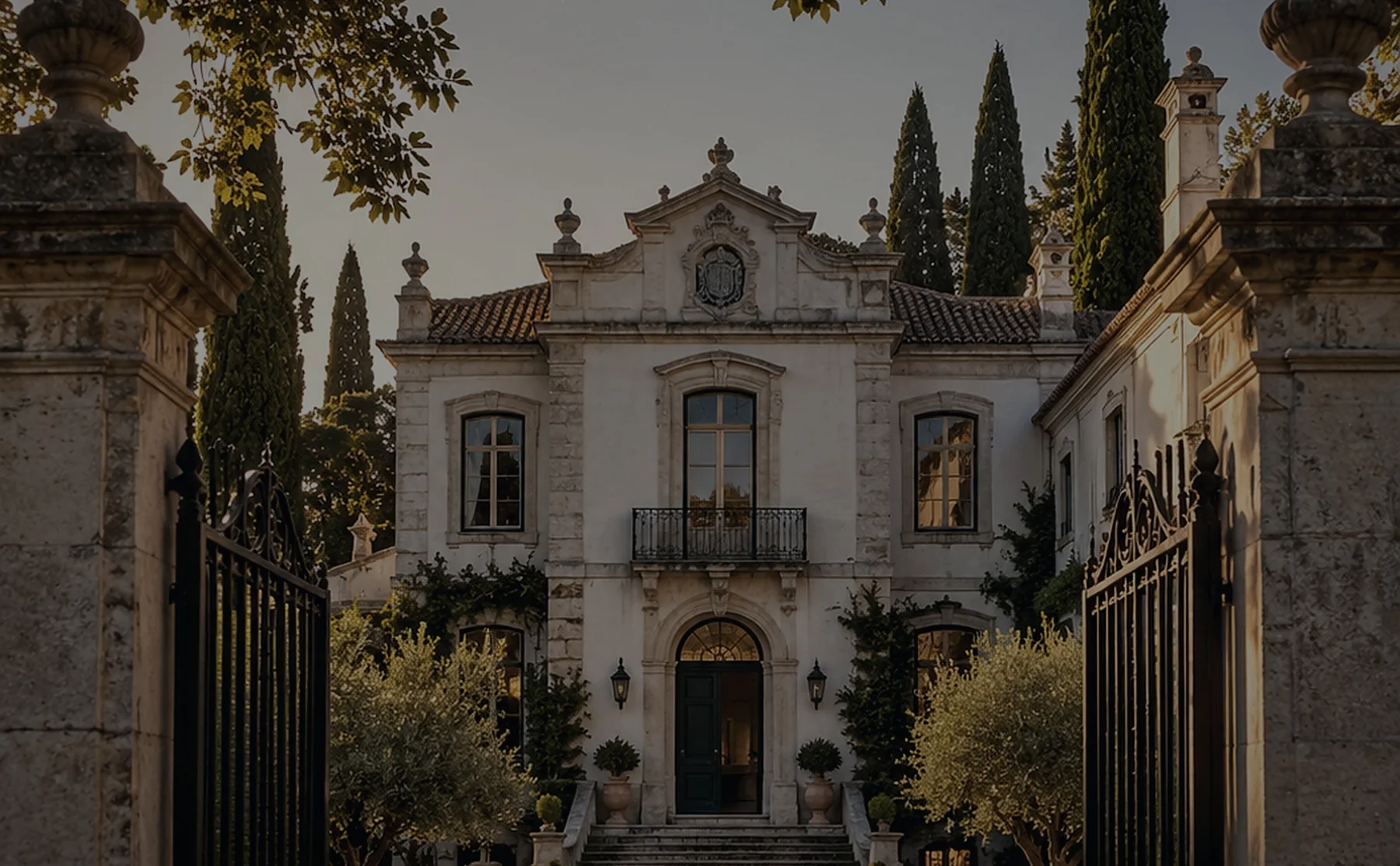 A wide view of a Portuguese manor house and gardens